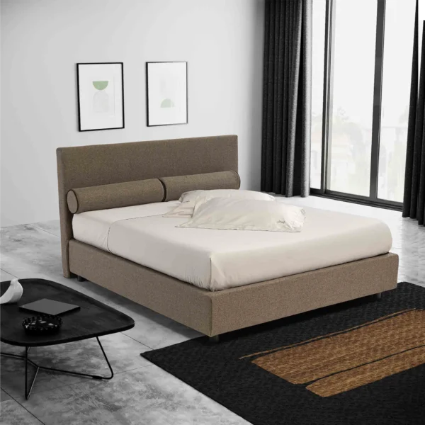 Letto contenitore con testata imbottita e cuscini cilindrici sfoderabili